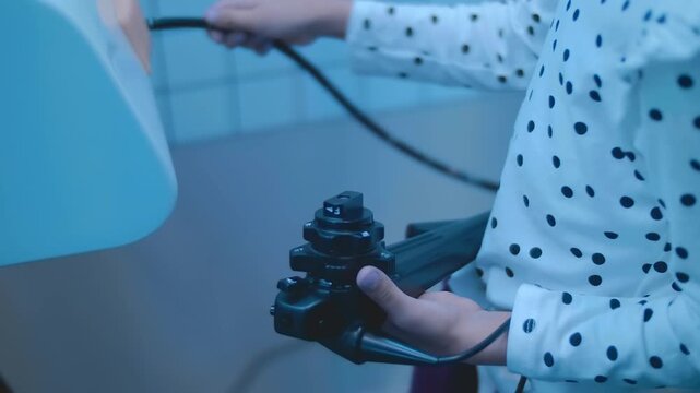 A child is learning the profession of a doctor on a simulator &ndash; performing an endoscopic examination of the stomach. Closeup