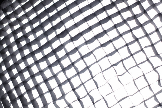 Softbox grid texture with light. Studio softbox grid texture with diffused light, abstract lighting pattern for photography, cinema and design backgrounds.