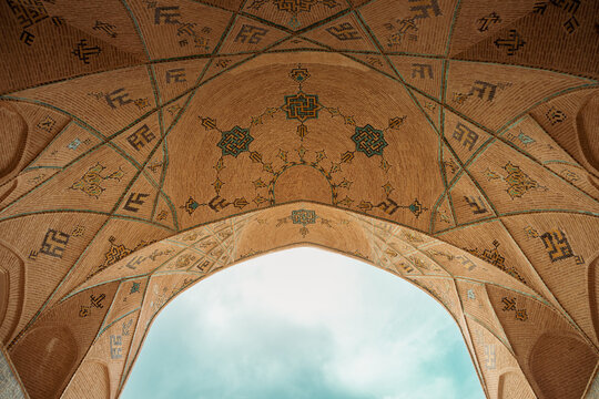 Semnan, Iran - 9 14 2024: The architectural design of the ceiling of the historical Shah mosque belongs to the Qajar era. Elaborate brick ornaments of the ceiling of an Iranian mosque.