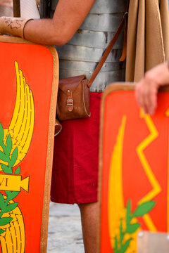 Close up of Roman legionary equipment and red shields. The Concept of Roman Legio VI.