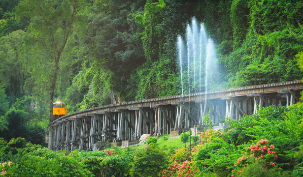 The train on the bridge over the river Kwai in Kanchanaburi, Thailand.