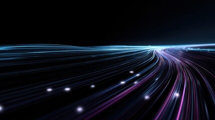 Long exposure image of a car driving on a dark road, creating light trails against a night backdrop.