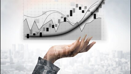 A professional businessman hand holds a financial graph indicating growth and analysis against an...