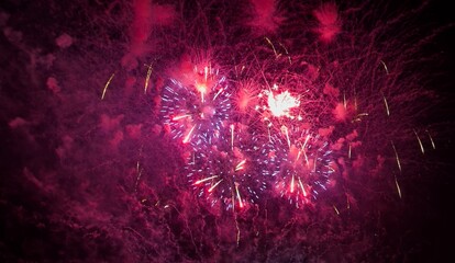 Colorful Fireworks iexploding in the night sky for New Year celebration and anniversary concept.