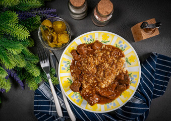 Beef goulash served with bulgur groats.