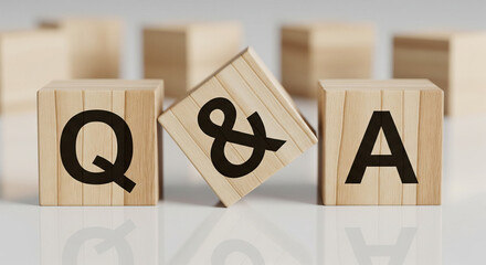 Wooden blocks spelling out Q&A, representing questions and answers in a session