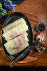 Cabbage rolls stuffed with meat and grits .