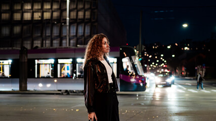 woman walking in the night city © Maryna