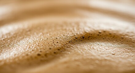 A close-up view of a frothy coffee surface