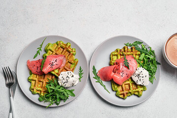 Healthy breakfast with green avocado based waffles and salmon