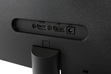 Connection connectors on the monitor. Power and HDMI ports. Back view of a computer monitor.