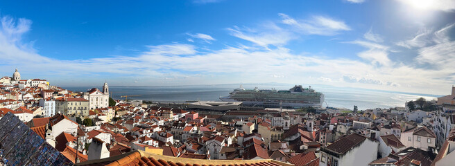 view of traditional rooftops in Lisboa, Portugal, with terracotta tiles and historic architecture creating a vibrant urban landscape, horizontal