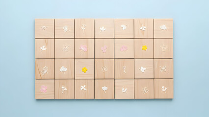 Wooden blocks with small flower and leaf designs on blue mother's day background tiles squares