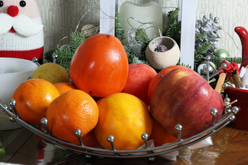 Sweet green pear, apple, and orange on a table for food. Wedge of ripe sweet pear.