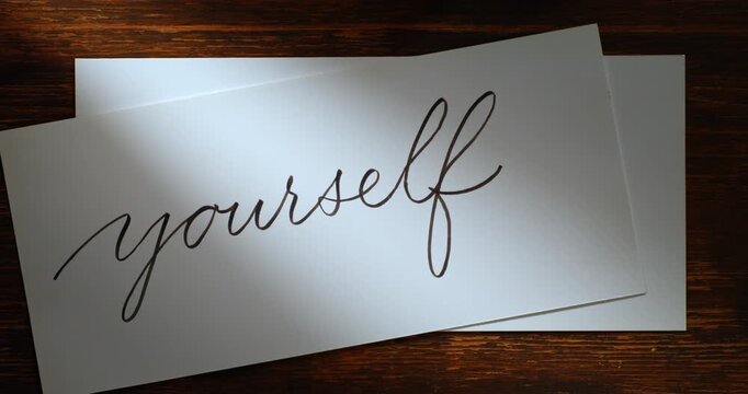 Slow Motion Close Up Of Hand  Showing Writing The Words Love Yourself With A Pen On White Paper At 1000 Fps. Concept Of Self Care, Mindfulness, Personal Growth, Calligraphy And Emotional Expression