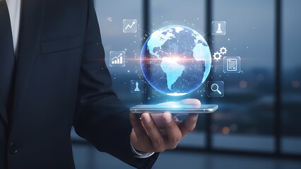 Businessman holding smartphone with digital globe and icons floating above screen