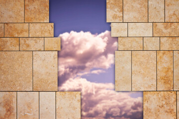 Through a open modern stone wall you can see the sky - freedom concept image
