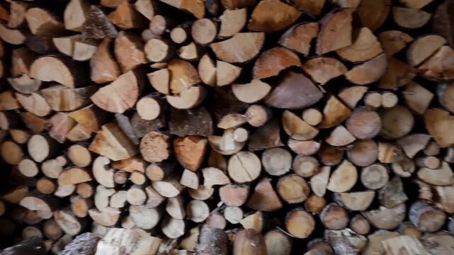 Detailed view of cut logs piled up for winter heating.