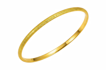 Luxurious yellow gold bangle with a sparkling sanded finish against a deep void