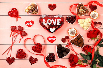 Food for Valentine's Day or Women's Day, Gourmet heart shaped chocolate candies, sugar cranberry, meringue and rose flowers, greeting card, advertising banner or store invitation.