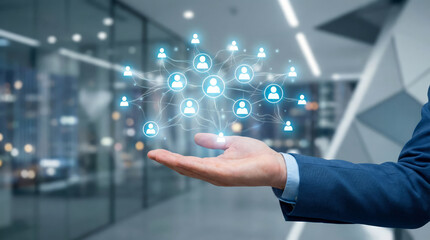 A hand reaches out to show a digital network of connected users, illustrating concepts of data sharing and social networking in a corporate setting. The scene highlights collaboration in business