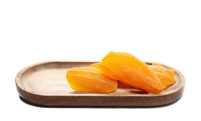 Candied mango slices in wooden bowl isolated on white background, side view