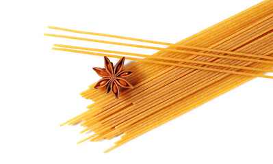 Spaghetti uncooked, integral pasta with star anise isolated on white background, top view