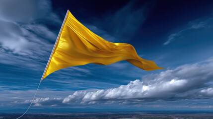 Yellow flag waving in the sky during the day near clouds