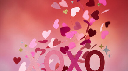 Falling paper hearts valentine background, xoxo love text letters, pink red romantic confetti explosion, cute papercraft greeting card concept, flying heart shapes, holiday celebration banner.
