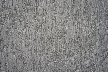 Obraz premium Rough gray concrete wall texture with vertical marks