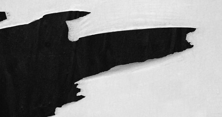 White ripped torn paper on black poster background creased crumpled backdrop surface, blank empty...