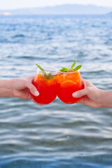 Refreshing drinks enjoyed by the sea during a warm afternoon at a beach resort for relaxation and fun