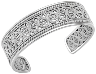 Intricate, highly detailed silver-toned metal cuff bracelet featuring a repeating floral and geometric pattern with raised relief carvings, gracefully curved and, isolated on transparent background.