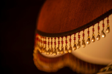 8K floor lamp detail. Close up photo of leather lamp with decorative details.
