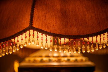 8K floor lamp detail. Close up photo of leather lamp with decorative details.