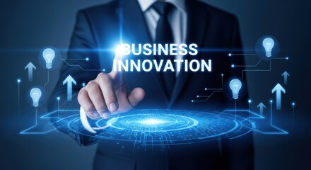 Businessman pointing at glowing business innovation text and digital circuitry on a dark blue background