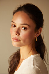 Serene young woman portrait in soft natural light