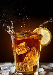 A tall glass filled with a dark, fizzy beverage, featuring a prominent lemon slice. 