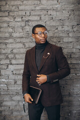 Obraz premium Young adult man wearing stylish suit and glasses