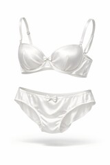 Glossy white satin bra and panties appear to float against a bright backdrop, creating a fresh, luxurious look suited for bridal campaigns, catalogs, and premium lingerie brands.