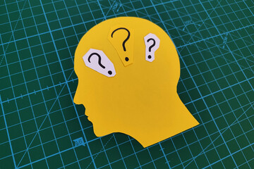 Question marks in human head. Mental health and problems with memory.