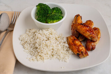 chicken wings with rice and broccoli