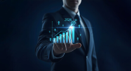 Businessman visualizing future growth with a holographic financial chart projection