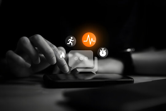 Futuristic Health and Fitness App Tracking on Smartphone Screen: Close-up of Hand Using Digital Wellness Interface with Icons for Heart Rate, Running, Calories, and Messaging in Dark Background. - Powered by Adobe