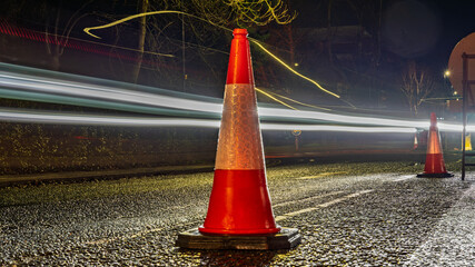 Traffic Cone with Light Trails at Night