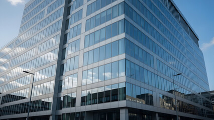 Ultra-realistic photo of a modern glass skyscraper reflecting a vibrant sunrise and clouds. Features crisp geometric lines and a clean, corporate aesthetic.