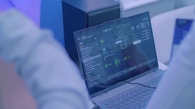 A little boy is learning the profession of a doctor on a simulator &ndash; uses a stethoscope to listen and identify the sounds of diseased lungs and bronchi. Closeup