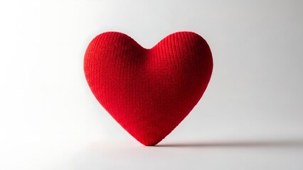 Obraz premium Bright Red Knitted Heart Shape on Plain White Background Soft Texture Love Symbol