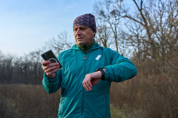 Runner syncing phone and smartwatch