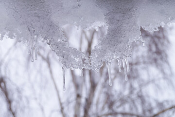 Icicles and snow in the shape of a heart